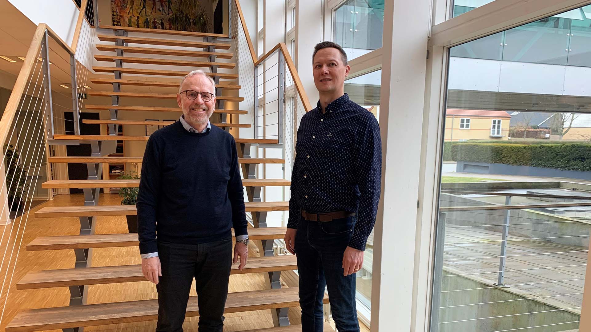 Karsten Bangshaab og Markus Kalalahti står side om side for at fejre sammenlægningen af Logimatic IDS og Roima Intelligence.