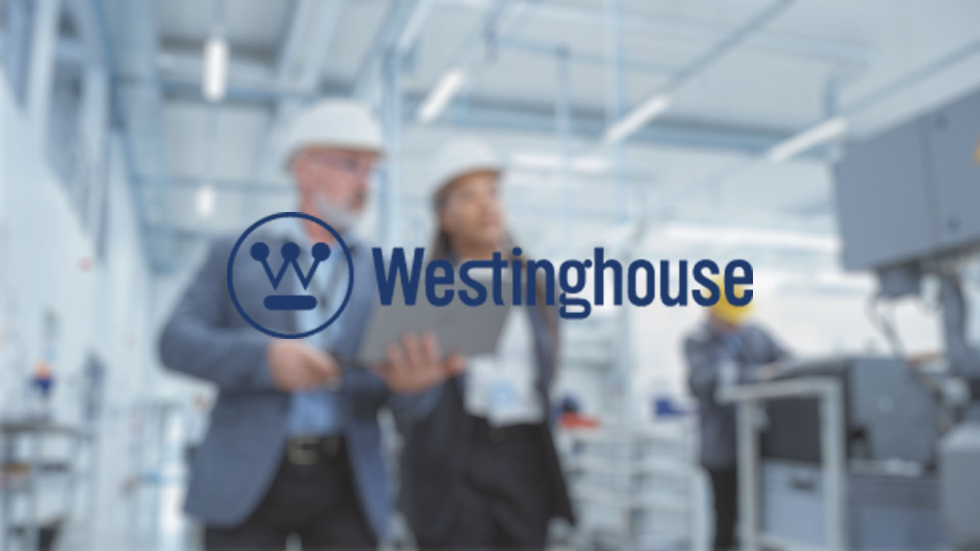 Blurry image of two professionals in hard hats inspecting machinery in a factory. "Westinghouse" logo is prominently displayed in the foreground.