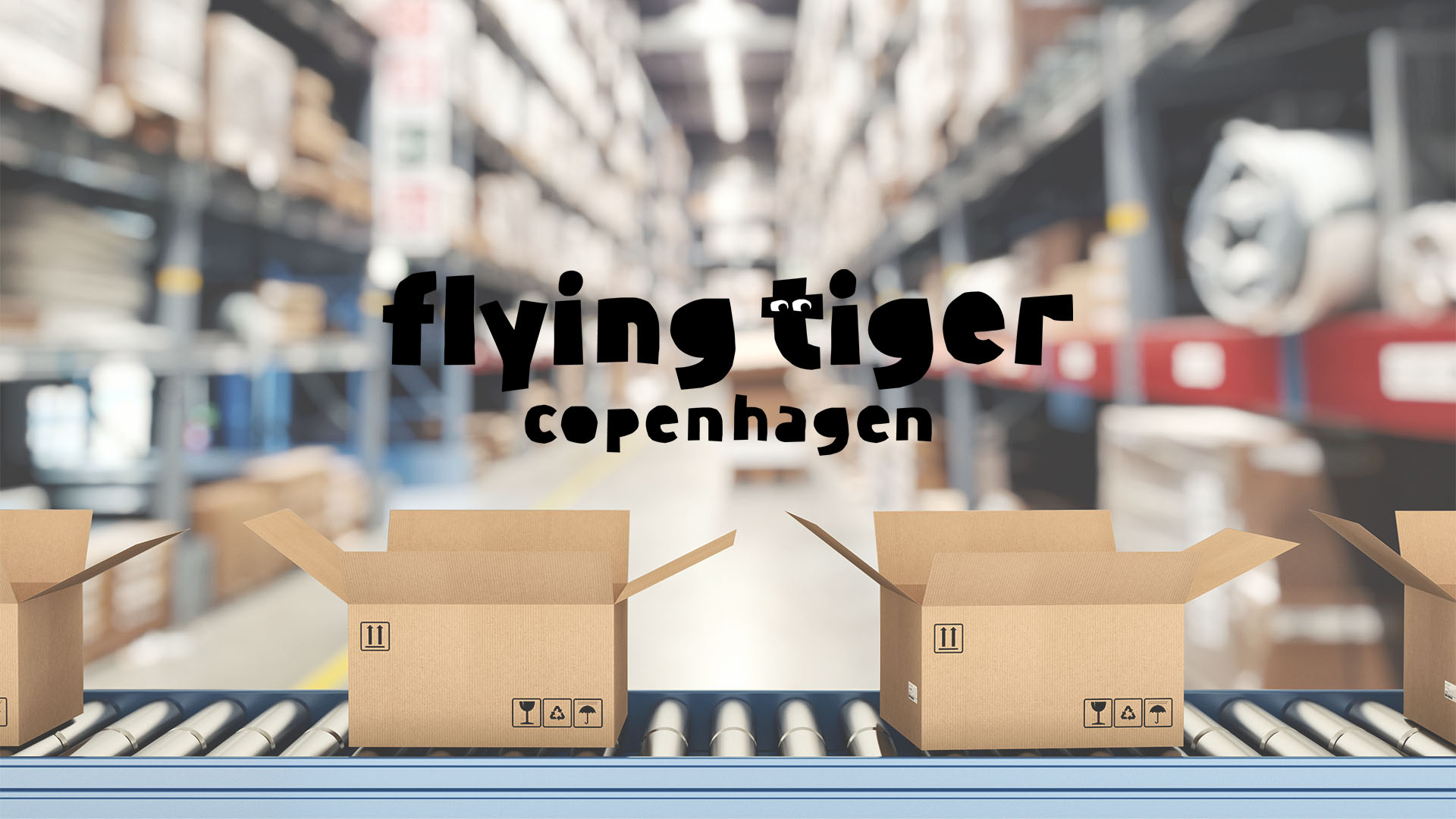 Open cardboard boxes on a conveyor belt in a warehouse, with blurred shelves in the background. "Flying Tiger Copenhagen" logo is prominently displayed.
