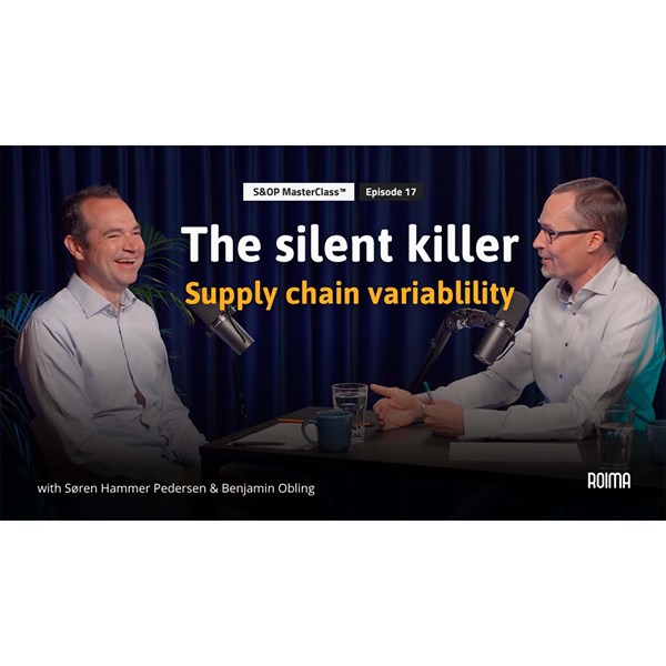 Two people discussing supply chain variability in a podcast studio.
