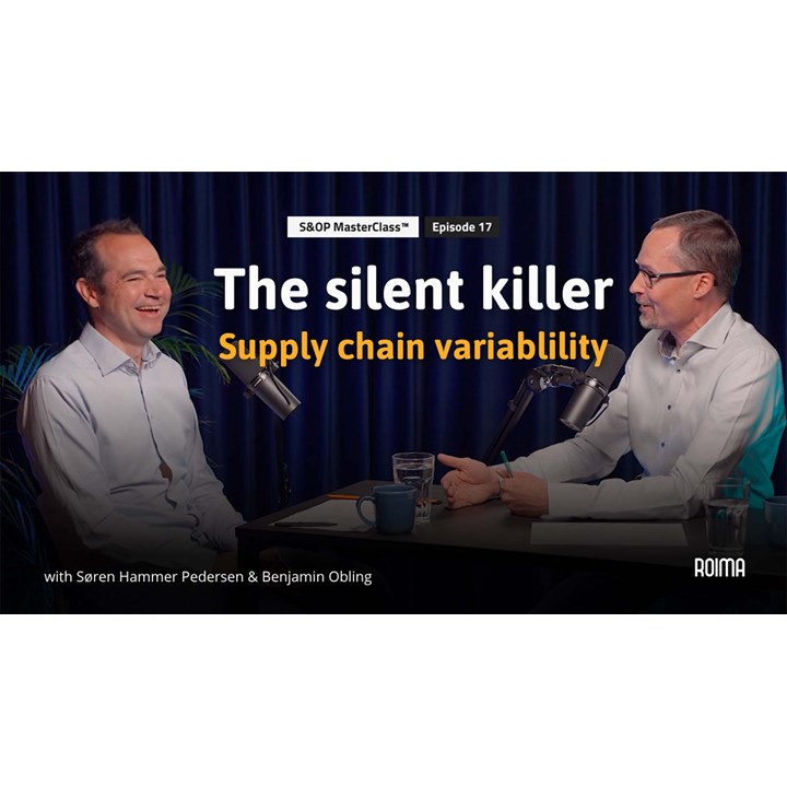 Two people discussing supply chain variability in a podcast studio.