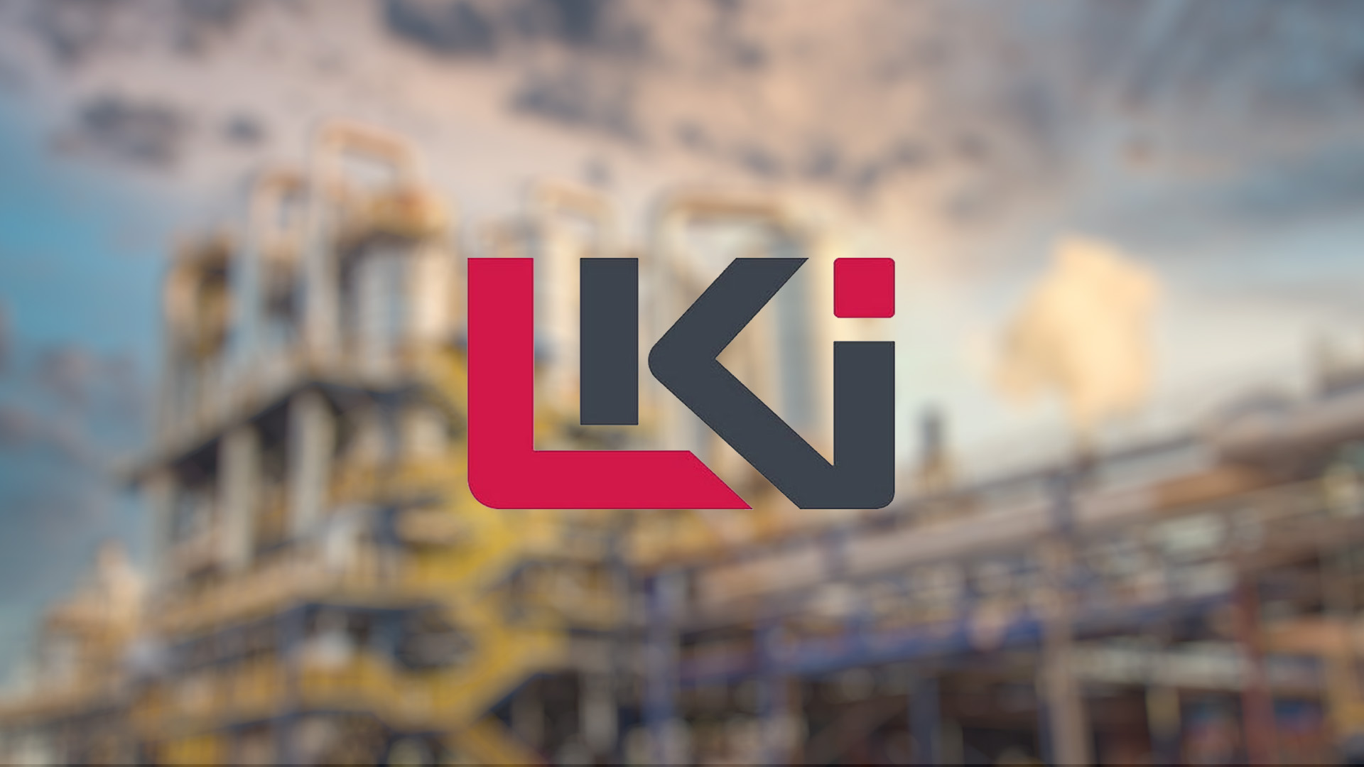 Red and gray "LKI" logo centered over a blurred industrial background with blue skies and wispy clouds.