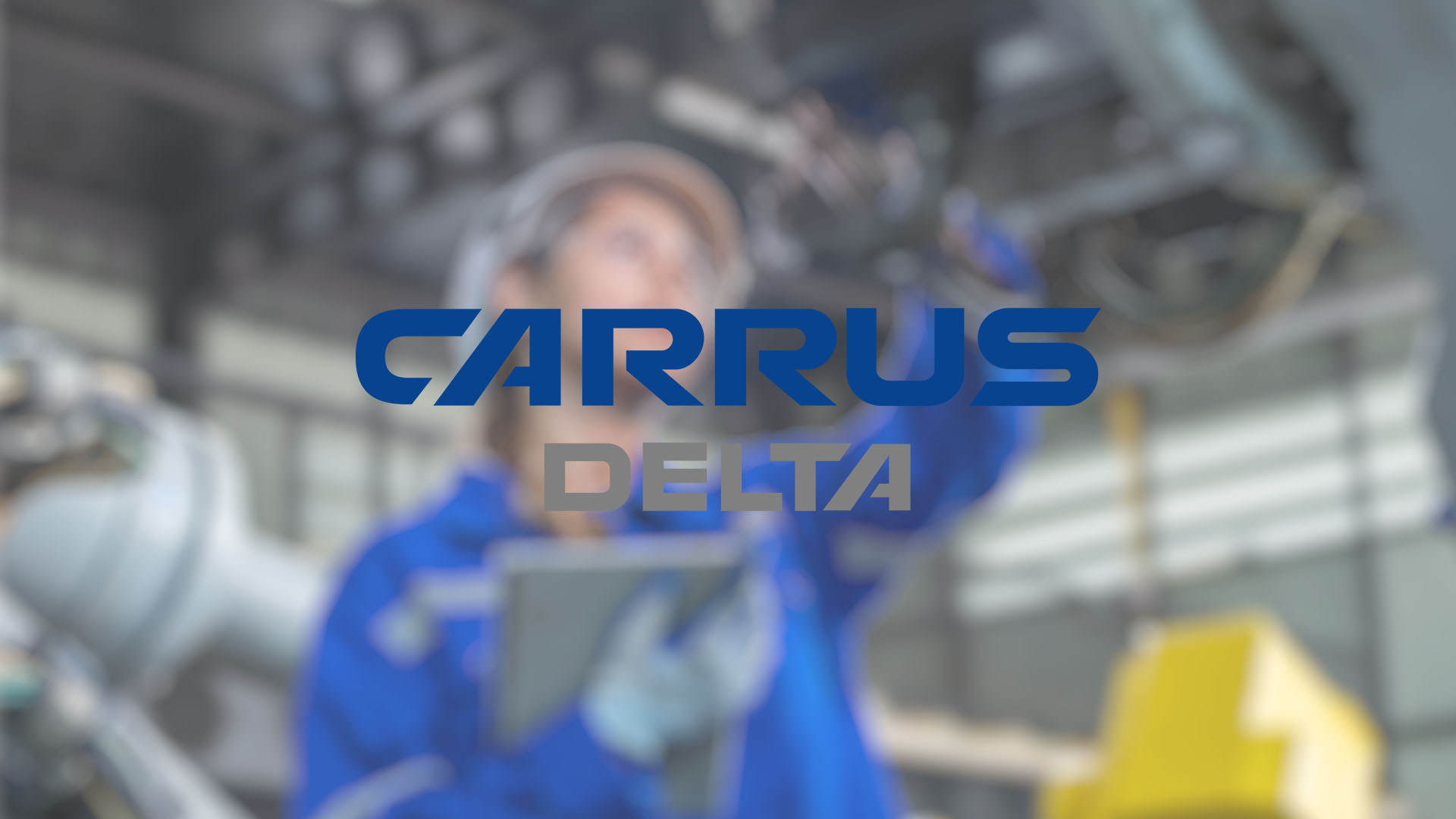 Blurred image of a person in a blue uniform and cap working in an industrial setting, holding a tablet. The logo "Carrus Delta" is in the foreground.